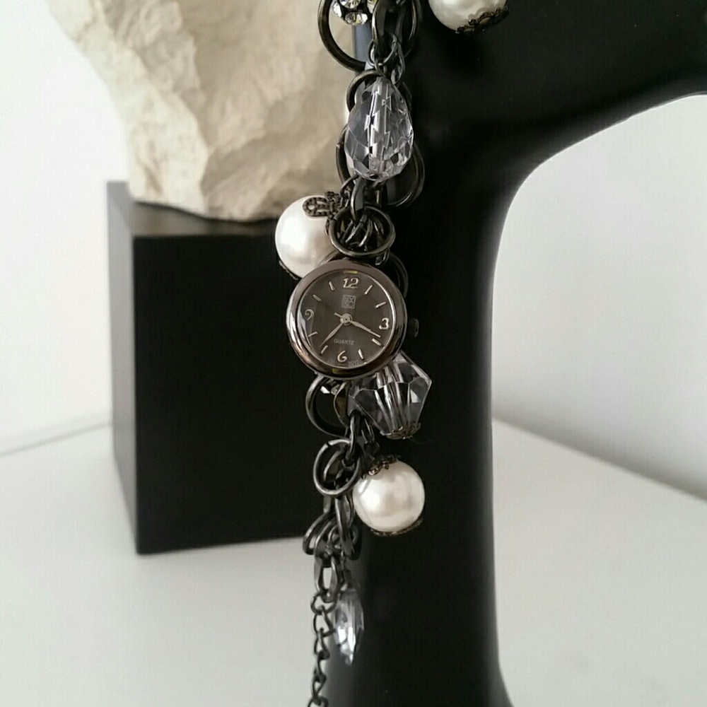 Ladies charm bracelet and watch